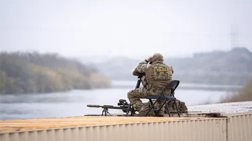 Border Patrol agent surveys the border
