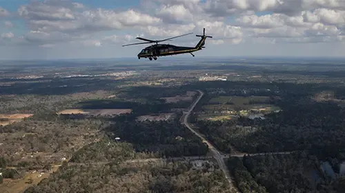 AMO helicopter across land